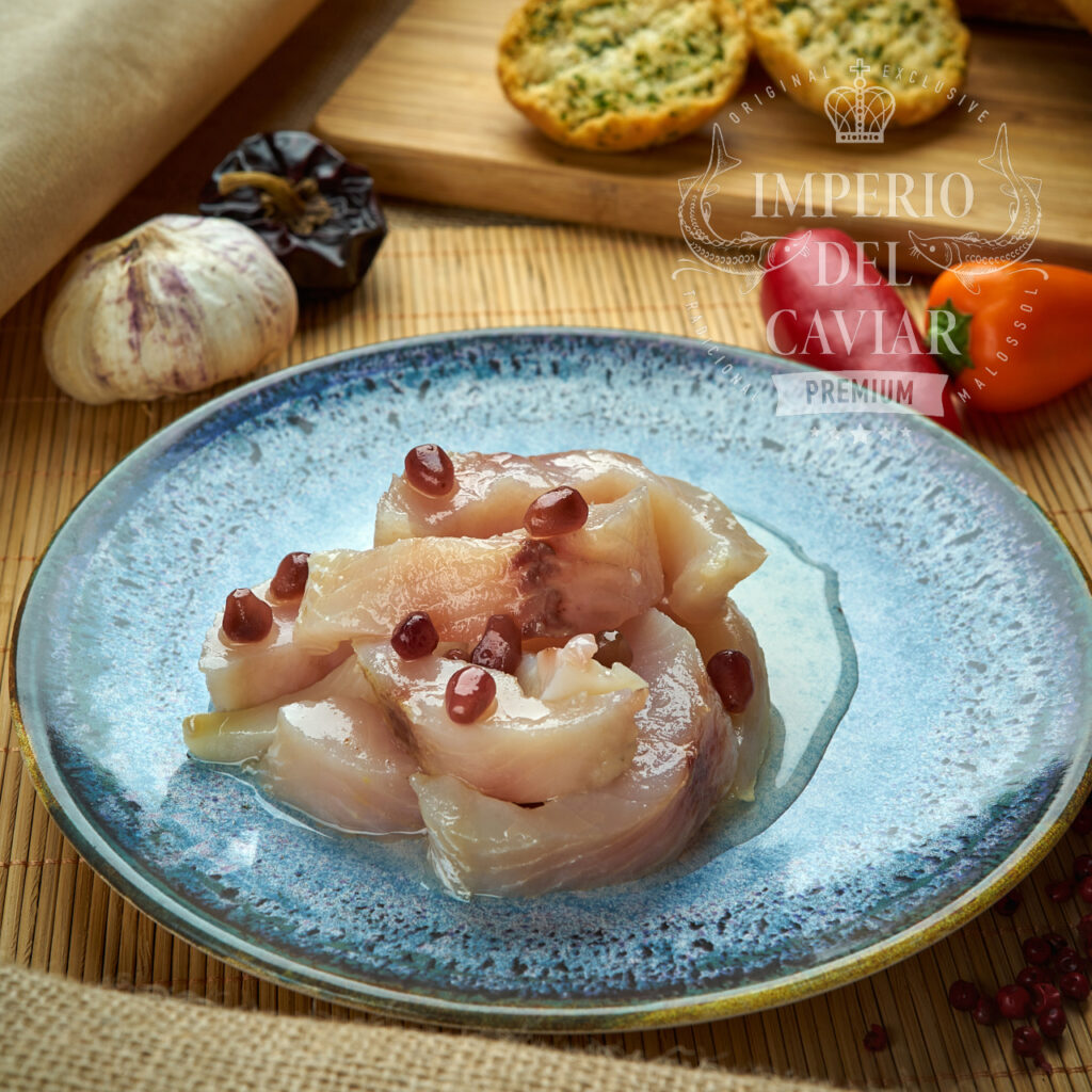 Trozos de filete de Muksun(Coregonus muksun) con aceite y granada (Congelado)