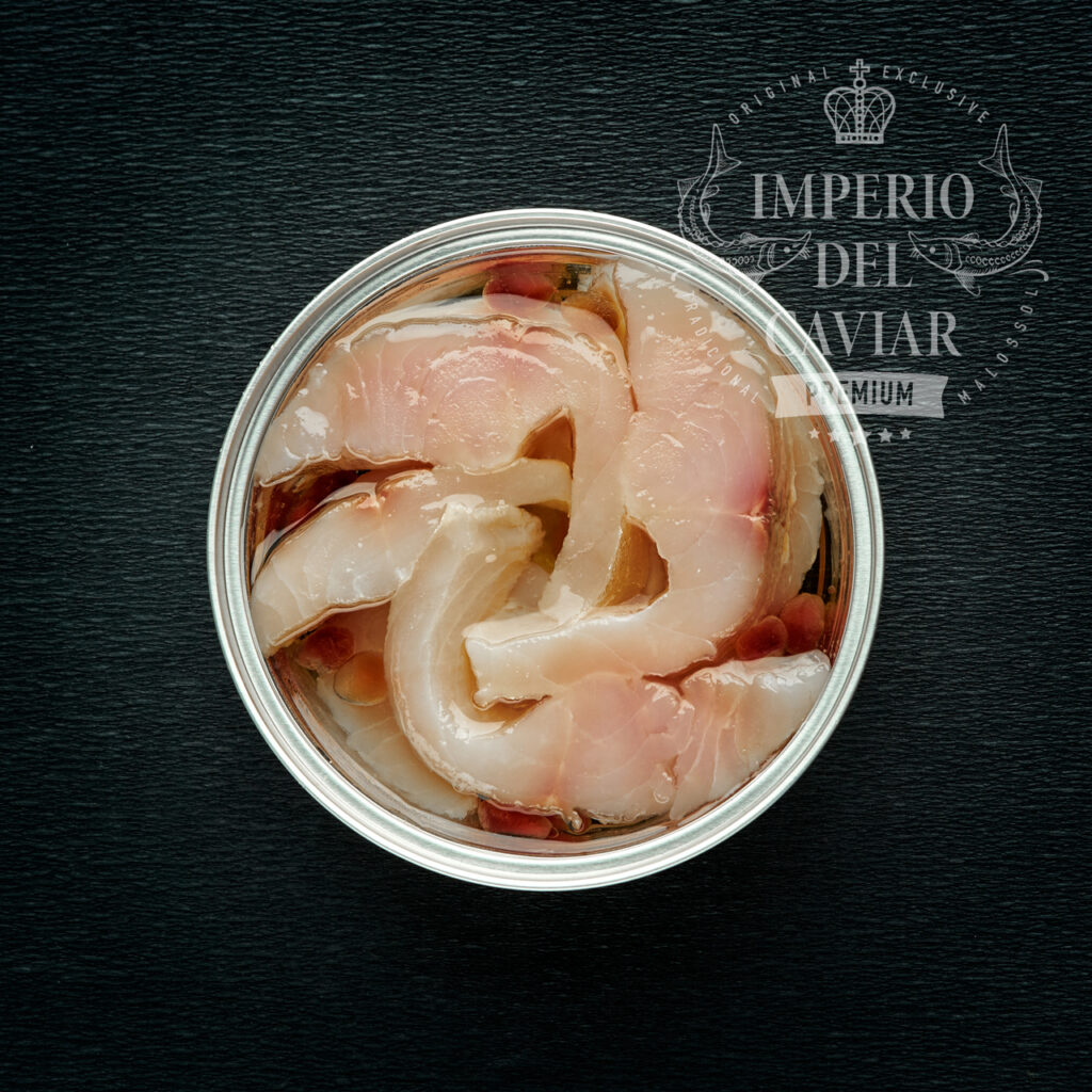 Trozos de filete de omul (Coregonus autumnalis) con aceite y granada (Congelado)